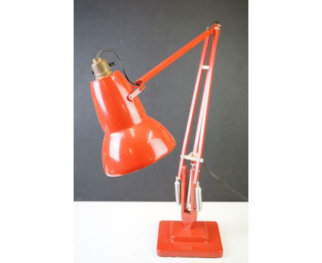 A mid twentieth century Herbert Terry Red Angle poise lamp with stepped base. 