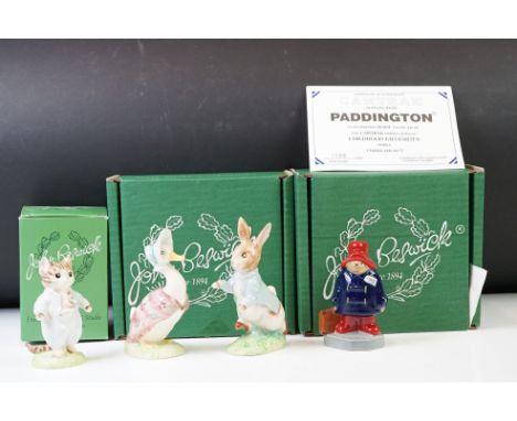 Three Beswick figures, comprising: Peter Rabbit, Jemima Puddle-Duck and Tom Kitten, all boxed, together with a Wade figure of