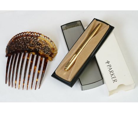 A cased vintage rolled gold Parker pen together with a faux tortoiseshell hair comb. 