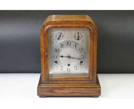 Early 20th century oak Westminster chiming mantle clock, with silver dial, Arabic numerals, slow/fast and chime/silent subsid