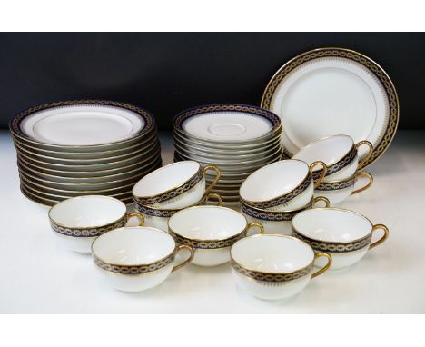 20th Century vintage Limoges tea service having a white ground with navy blue and gilt rims. Green Renaud J Clermont marks to
