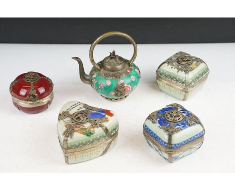 Four Chinese porcelain trinket boxes with white metal mounts depicting dragons, birds &amp; butterflies, and a small famille 