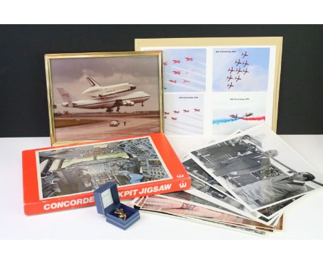 A small group of aviation collectables to include Concorde tie pin, framed space shuttle photograph, jigsaw puzzle, red arrow