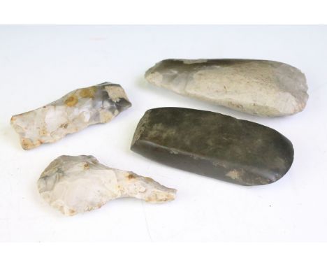 A collection of three Neolithic flint tools together with a stone age example. 