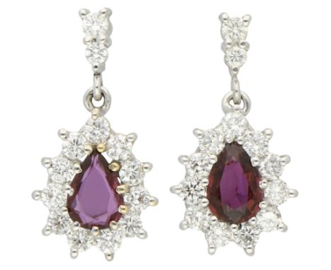 18K White gold stud earrings set with natural ruby ​​and diamond. Set with two pear cut natural rubies (treated) of approx. 2