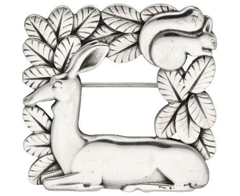 Georg Jensen sterling silver brooch of a deer, no. 318. Brooch featuring a deer and squirrel between leaves. In good conditio