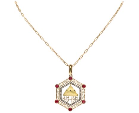 14K Yellow gold Romanov Tercentenary pendant with ruby and diamond. Hexagonal pendant with the Russian imperial crown in the 