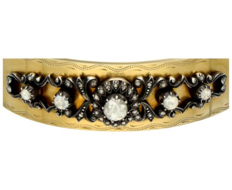 Gold/silver bangle bracelet with applique set with rose cut diamonds. Set with a silver applique of five rose cut diamonds (a