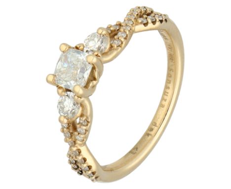 GIA-Certified 14K yellow gold braided ring set with approx. 0.86 ct. diamond. Set with a central cushion cut diamond (treated