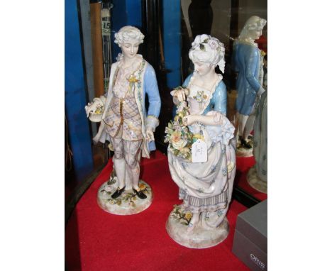 A pair of impressive Meissen? ceramic figures of man and woman, having cross swords mark to base and standing 50cm high CONDI