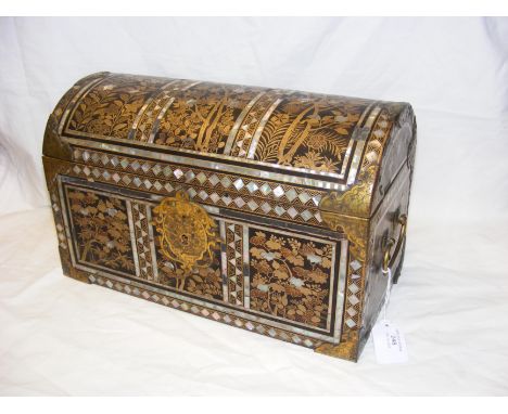 An antique Namban chest, lacquered wood with golden mother of pearl decoration and floral arrangements, having decorative gil