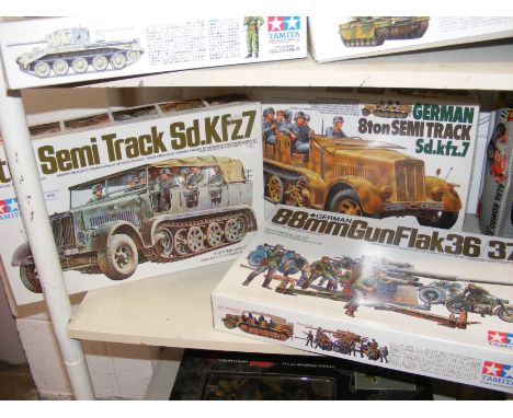 Three Tamiya model kits of military vehicles, including 8 Ton Semi Track SD.KFZ7 