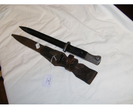 A WWII bayonet with metal scabbard - 40cm long overall CONDITION REPORT Our team of trusted experts are on hand to help and a