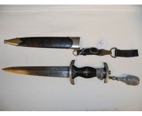 A German WWII SS dagger with wooden grip and etched blade 'Meine Ehre Heist Treue' - 37cms long overall, with metal scabbard 