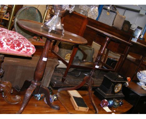 A circular wine table with carved tripod support, together with one other