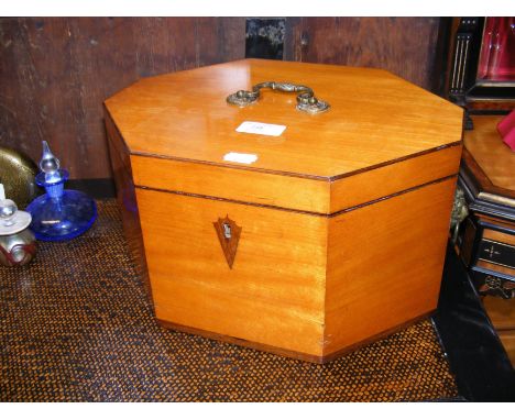 An antique octagonal satinwood box CONDITION REPORT In our judgement, condition of lot is fair. Notably, the item sports some