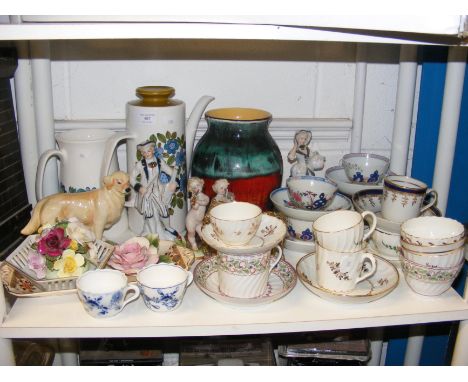 A pair of continental cherub figures, together with assorted antique teacups and saucers and other collectable china 