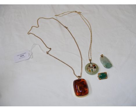 A jade pendant on chain etc.