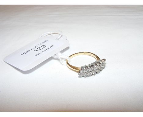 An 18ct gold 14 stone diamond ring 