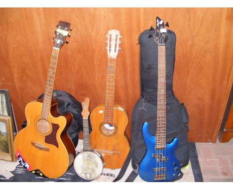 A quantity of guitars including Tanglewood TW-155A8 six string acoustic and Liberty electric base guitar