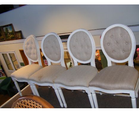 Four modern dining chairs with button back