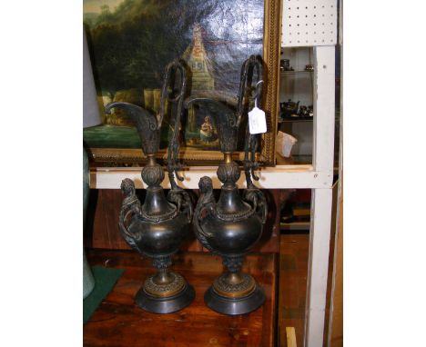 A pair of antique bronze ewers - 50cm high 