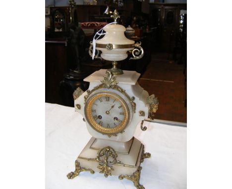 A Continental alabaster gilt mounted striking mantel clock by Luppens, Brussels - 40cms high