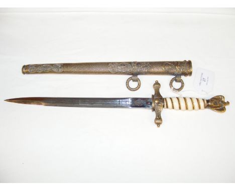 A WWII German Naval Officer's dirk, having wire bound grip and eagle pommel - 40cms long overall, with metal scabbard CONDITI