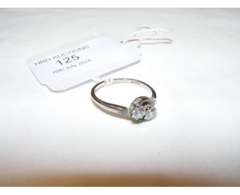 A two stone diamond crossover ring in 18ct white gold mount 