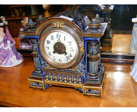 A Doulton Lambeth stoneware mantel clock - 26cms high CONDITION REPORT In our judgement, condition of lot is good and offered