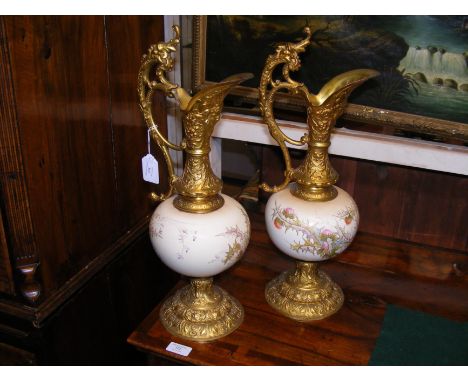 A pair of decorative ceramic and metal ewers - 48cm high 