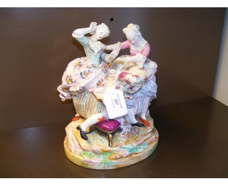 A Continental ceramic figural group of dancing men and women with mark to base - 24cms high