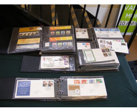 Two albums of First Day Covers, together with an album of Mint stamp sets (four albums altogether)