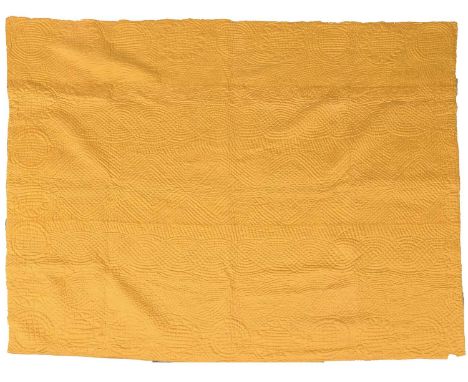 A Late 19th Century Wholecloth Quilt in yellow and blue with stylish hand quilting overall, incorporating trellis and circula