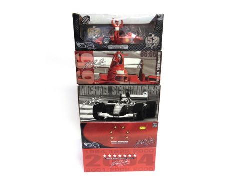 FOUR 1/18 SCALE FERRARI FORMULA 1 RACING CARS  comprising a Hot Wheels Ferrari F2001 (M. Schumacher); Hot Wheels Ferrari F200