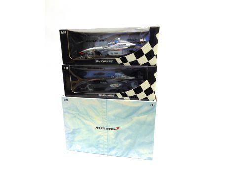 THREE 1/18 SCALE MCLAREN FORMULA 1 RACING CARS  comprising a Hot Wheels McLaren Mercedes MP4-20 (K. Raikkonen), mounted to a 