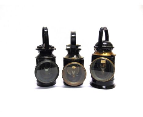 THREE RAILWAY HAND LAMPS  comprising a London, Midland & Scottish Railway three aspect hand lamp, repainted black, complete w