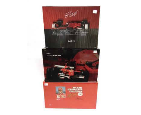 THREE FERRARI FORMULA 1 RACING CARS  comprising a 1/18 scale Hot Wheels Ferrari F248 F1 [Anatomy] (M. Schumacher); 1/18 scale