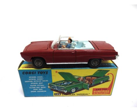 A CORGI NO.246, CHRYSLER IMPERIAL   red, with cast hubs, complete with driver and passenger figures, and golf bag in boot, ne