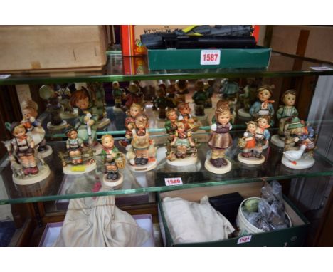 Fifteen Hummel figures.