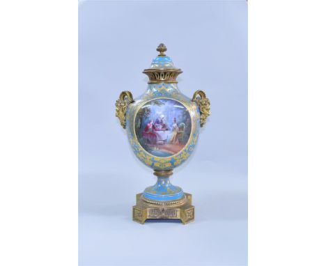 A good late 19th century Sevres style and gilt bronze pedestal vase and cover, finely painted to one side with an oval panel 