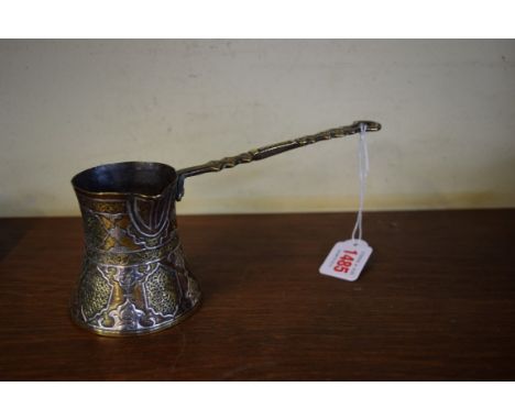 A Cairo ware small ladle, with lipped spout, 21.5cm long. 