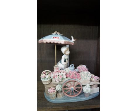 A Lladro 'Flowers of the Season' figure, model 1454, 28cm high.  Condition Report: Overall condition is good, however there i