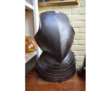 A 17th century style steel breastplate armour; together with an English civil war style helmet. 