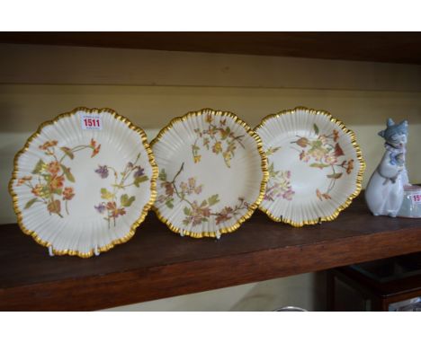 A set of three Victorian Royal Worcester dessert plates, 21.5cm diameter, (repair to one). 