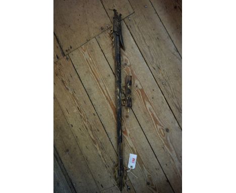 An eastern carved bone dragon pipe, 89cm long.