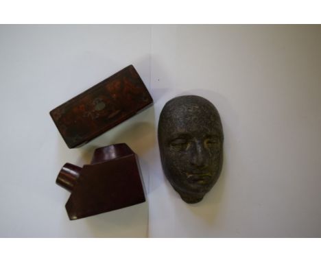 A lead mask form paperweight; together with a papier-mache snuffbox; and another pipe bowl. Condition Report: The pipe rest h