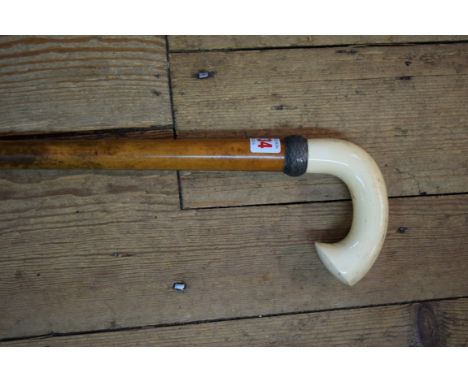 A Victorian ivory and malacca walking stick, with silver basketweave collar. 