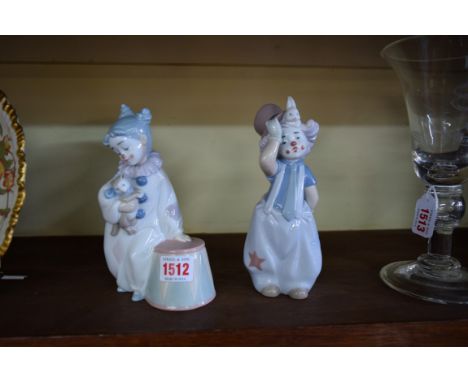 Two Lladro figures of child clowns, 19cm high.  Condition Report: Both figures are in good order, no visible sign of damage s