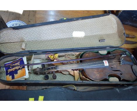 A circa 1900 Continental violin, with 14 inch back, with bow and stained pine case. 